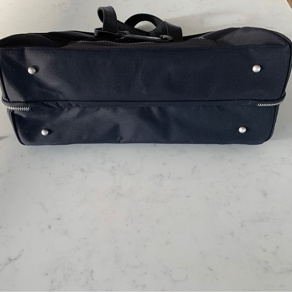 Black Travel Bag with Structured Design and Metal Feet - Picture 2 of 16